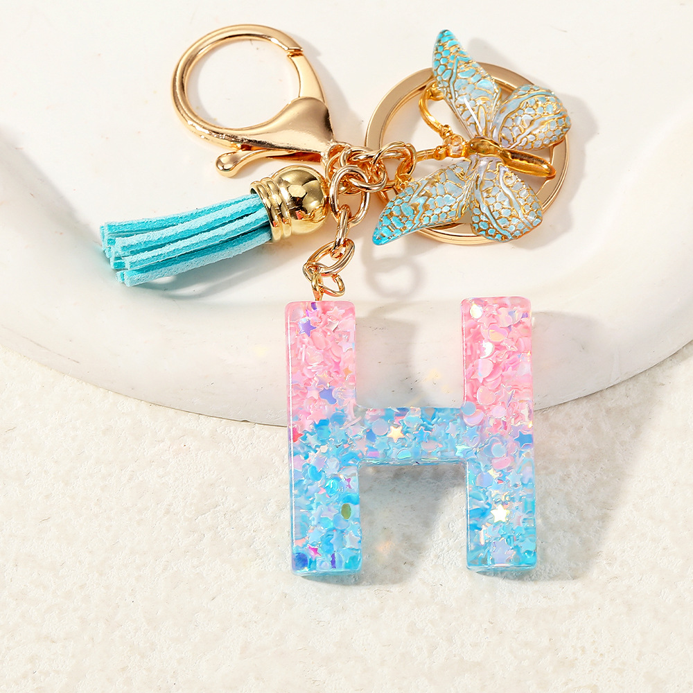 Europa y los Estados Unidos transfronterizos nuevos cristal sequinado goteo de goma letras inglesas joyería llavero y bolsos colgante apoyo al por mayor