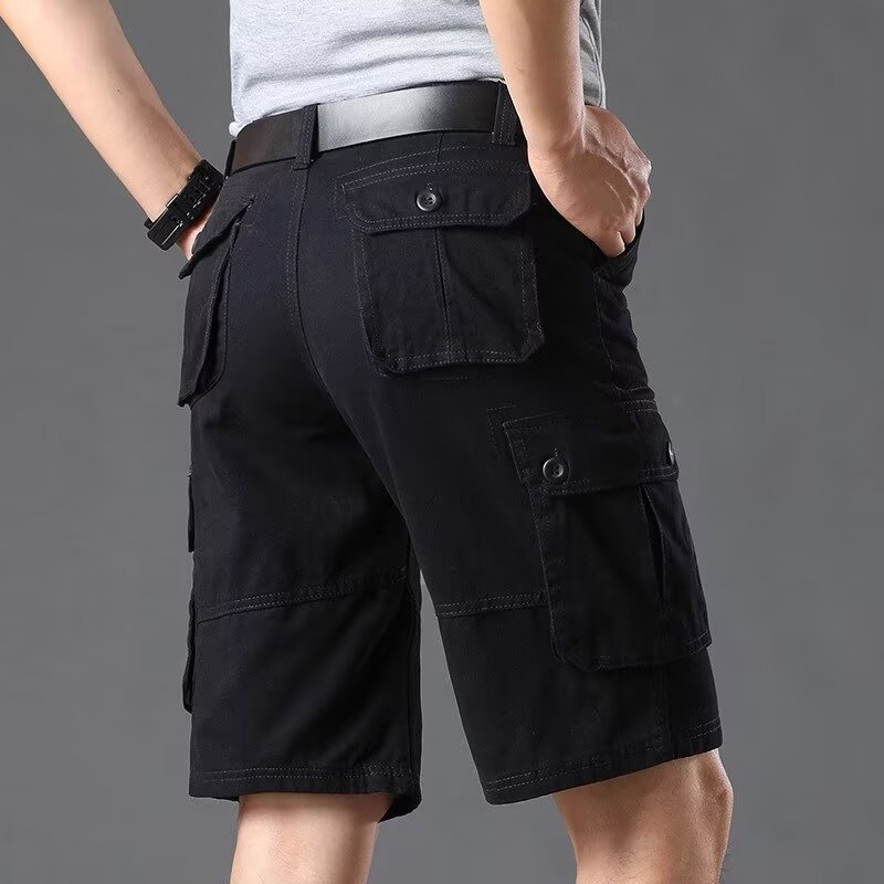 Inventario de verano pantalones cortos sueltos de bolsillo pantalones de herramienta de moda pantalones elásticos de cinco puntos pantalones casuales delgados para hombres