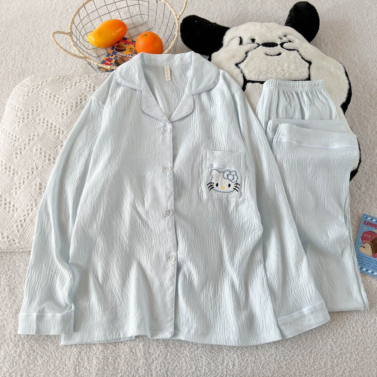 Al por mayor transfronterizo KT gato pijama mujer primavera y otoño nubes algodón manga larga 2026 nuevo juego de ropa de hogar encantadora super caliente