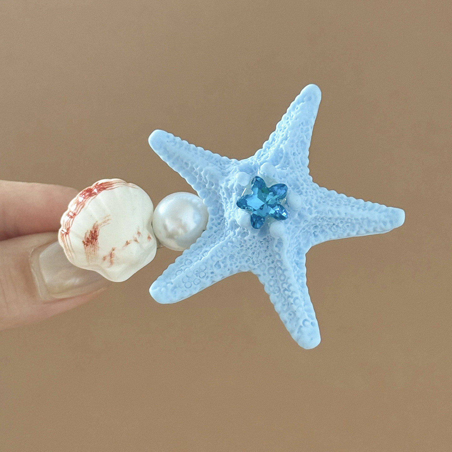 1# Horquilla de concha de estrella de mar azul, de aproximadamente 5.5 cm.