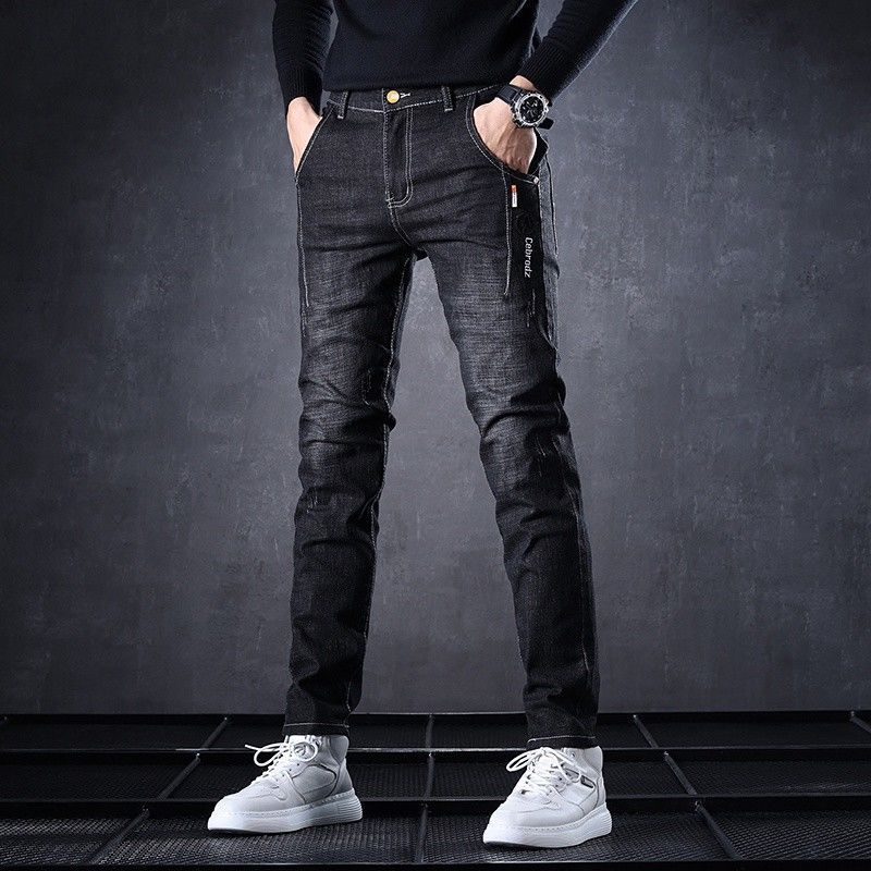 Jeans de lana para hombre otoño y invierno 2026 estilo recto suelto elástico alto calentamiento marca de moda pantalones casuales
