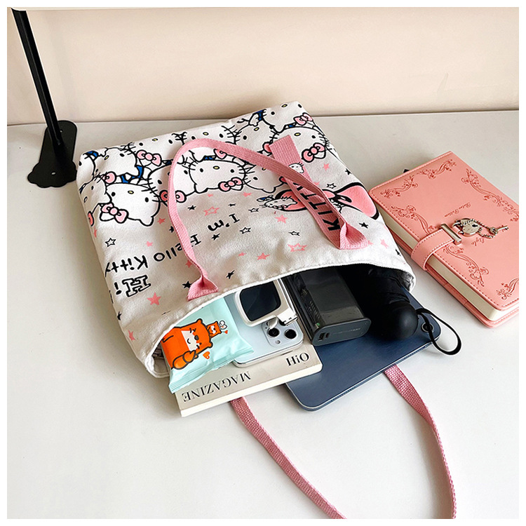 The new fashionable cartoon canvas bag, simple and versatile tote bag, cute commuting single-shoulder tote large bag, is selling well across borders undefined