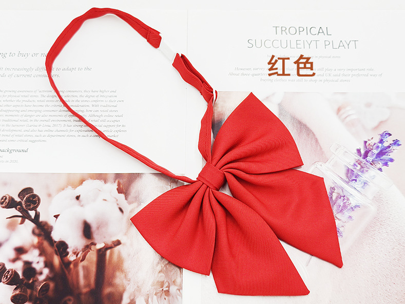 Fábrica directa mate pluma raíz pajarita hembra más tamaño pluma roja raíz coreana Colegio estilo sólido color JK pajarita collar flor