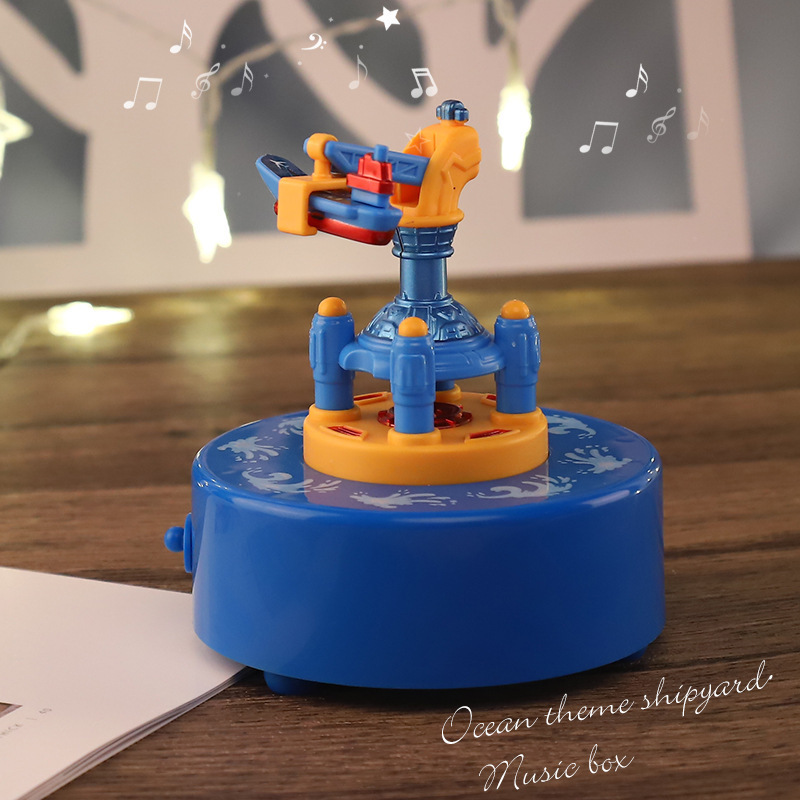 Base naval de dibujos animados amazonos niños caja de música pianos astronautas girando planetas explorando cajas de octeto