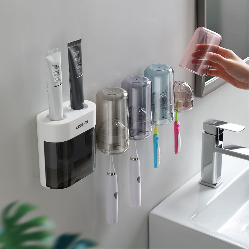 En stock venta al por mayor cepillo de dientes rack Punch-libre montado en la pared hogar Baño creativo automático pasta de dientes exprimidor