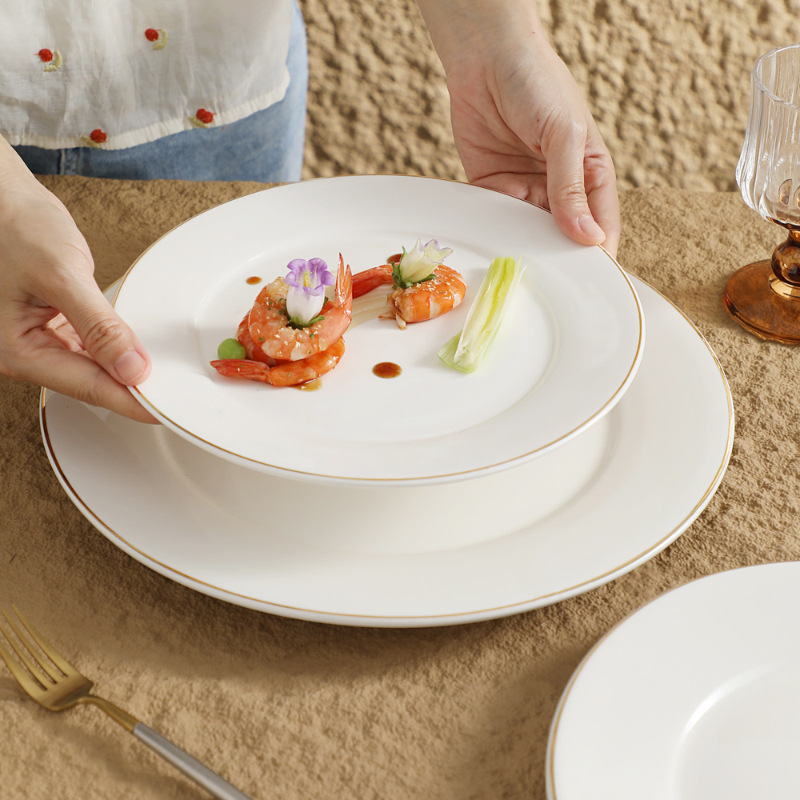 Restaurante de platos de comida occidental redonda de cerámica blanca pura Phnom Penh plato de filete de alta gama plato plano escupir hueso plato plato plato plato plato plato