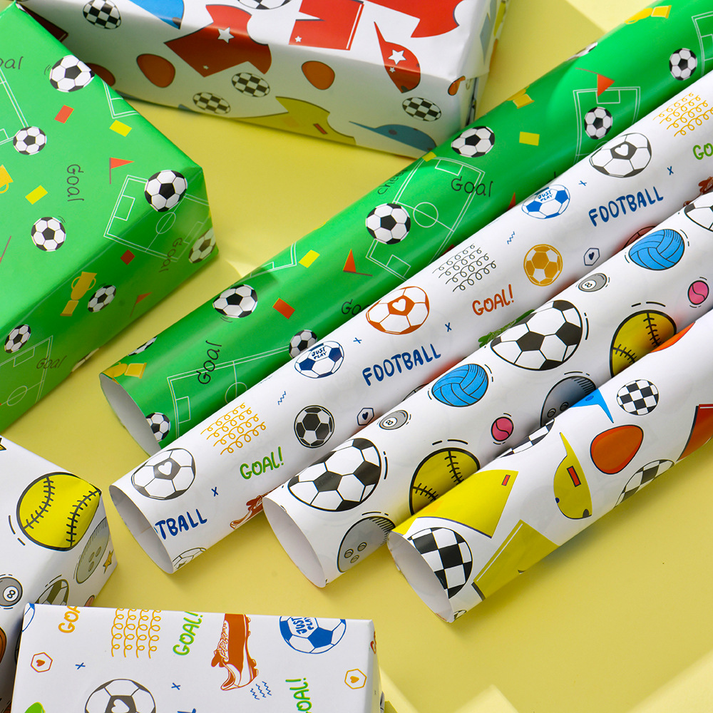 Nuevo papel de regalo de dibujos animados transfronterizo al por mayor Papel de embalaje de baloncesto de fútbol del Día de los niños en stock