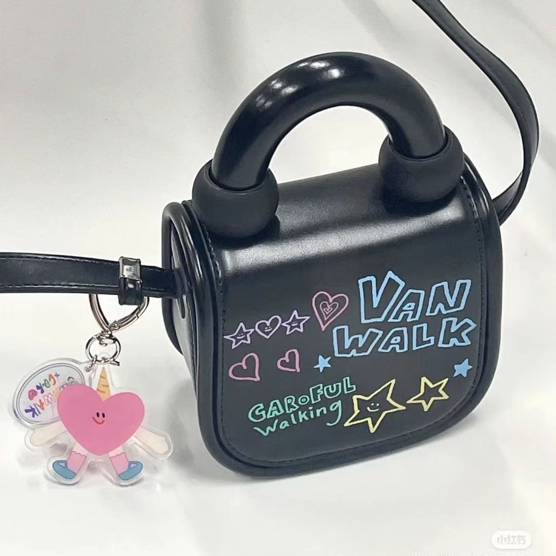 2023 primavera y verano nuevo estilo coreano estudiante bolsa de mensajero bolsa de moda Mini lindo estilo occidental de dibujos animados bolsa de graffiti para mujeres
