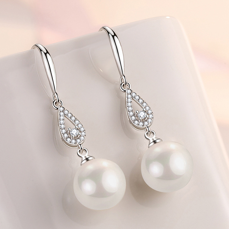 Brand earrings from pearl drop-shaped