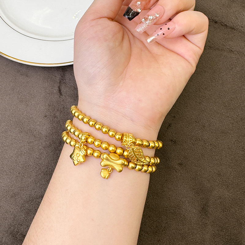 Brazalete de oro de arena vietnamita de mares estriados, cuentas de estrellas, huesos, pulseras de hojas, lujo ligero, joyas no se desvanecen.