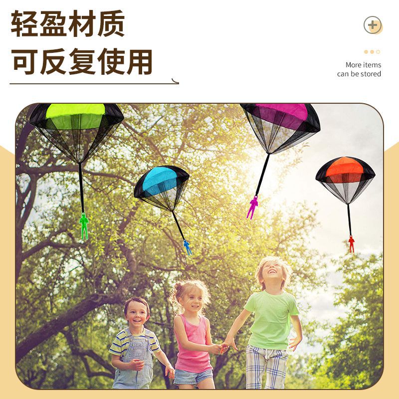 En stock mano de los niños lanzando paracaídas juguete soldado paracaídas cuadrado deportes al aire libre kindergarten actividad puesto