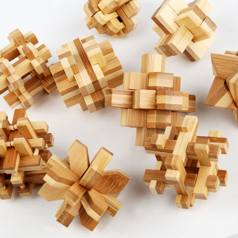 Suministro directo de fábrica para niños rompecabezas de desbloqueo Kong Ming traje de bloqueo de bambú Luban bloqueo traje de inteligencia juguetes al por mayor