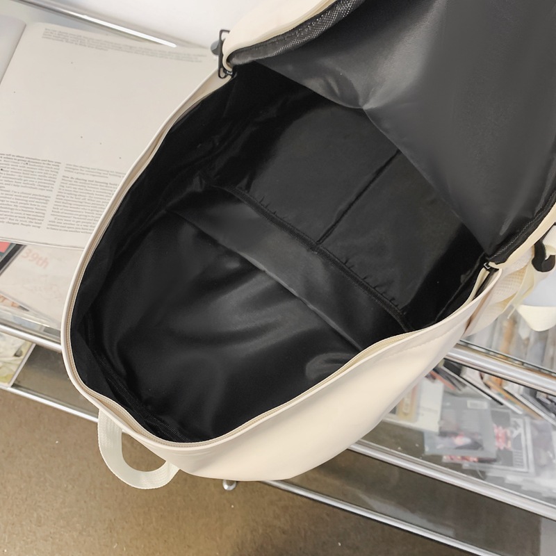 Fábrica al por mayor 2023 nueva mochila de PU de gran capacidad para estudiantes de secundaria de ocio, mochila de viaje al aire libre literaria simple