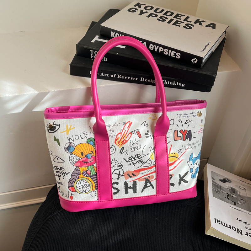Invierno nuevo bolso de mujer personalidad graffiti portátil 2026 letras casuales Bear Tot bolso de cubo de hombro mochila