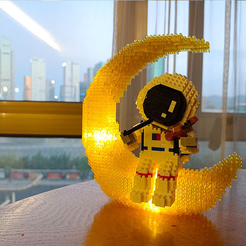 Compatible LEGO astronaut block micro particles Xiaohongshu glowing space band assembly educational toy wholesale