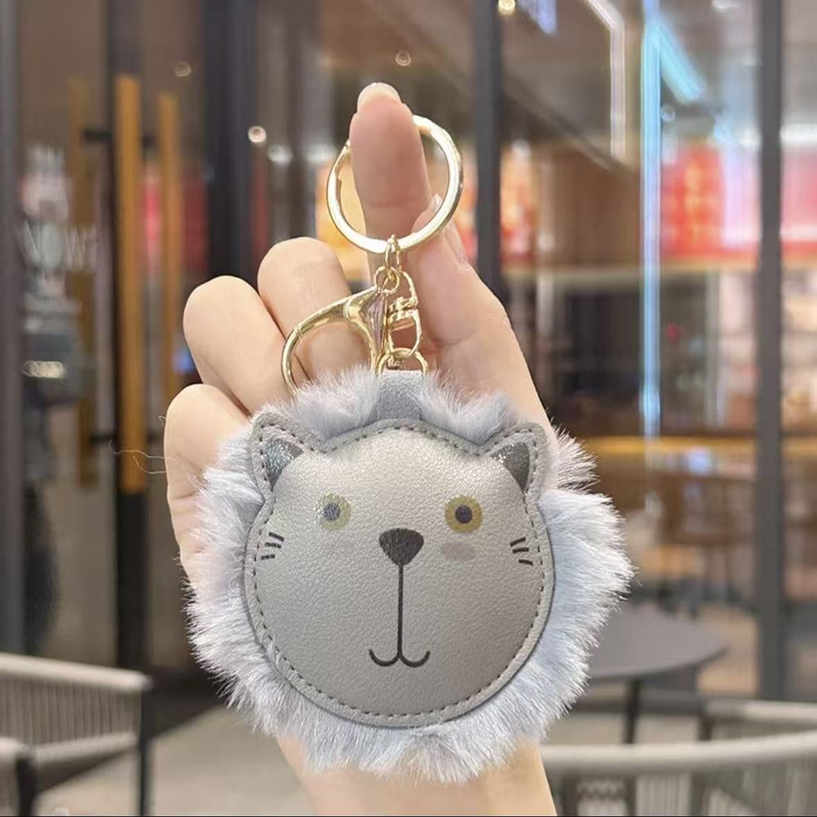 Transfronterizos peluche extraño león llavero de cuero bolsos de pareja colgante lindo llavero de automóvil pequeño regalo