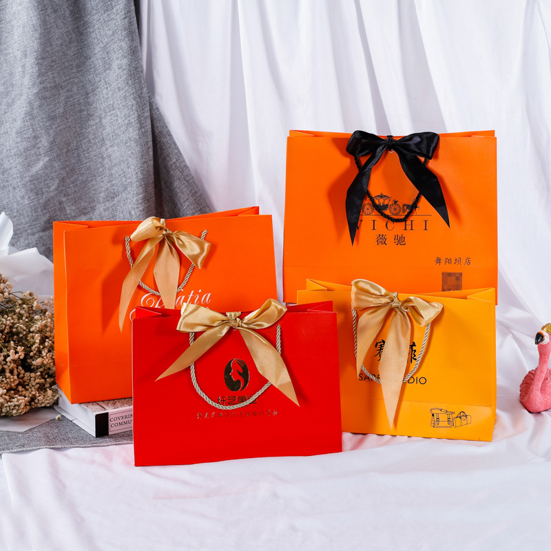 白卡牛皮纸袋手提袋蝴蝶结礼品袋印刷LOGO礼品袋服装包装袋批发