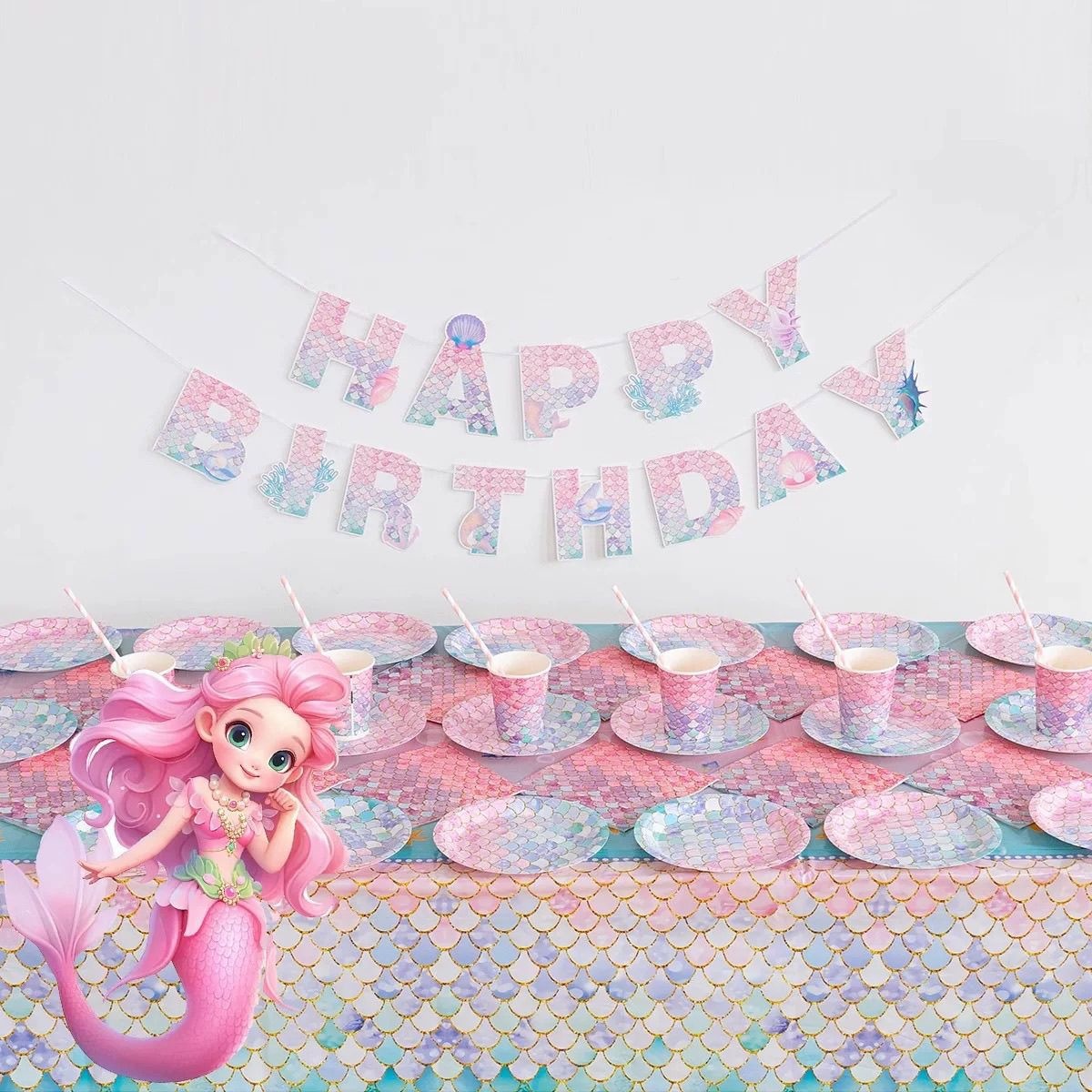 Mermaid-themed fresh decorations for a girl's birthday party, including disposable cake plates, tablecloths, paper cups, straws, and decorations