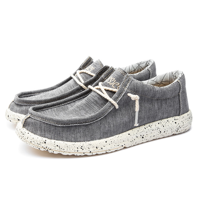 2025 al por mayor de primavera de mediana edad nuevos zapatos casuales de hombre zapatos de tela transpirables zapatos de lona PU ligeros zapatos de pedaleos