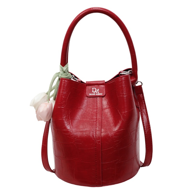 Bolso de cubo de jardín de verano 2025 nuevo bolso de mano estilo extranjero bolso de hombro con patrón de piedra pequeño bolso de mensajero fresco para mujer