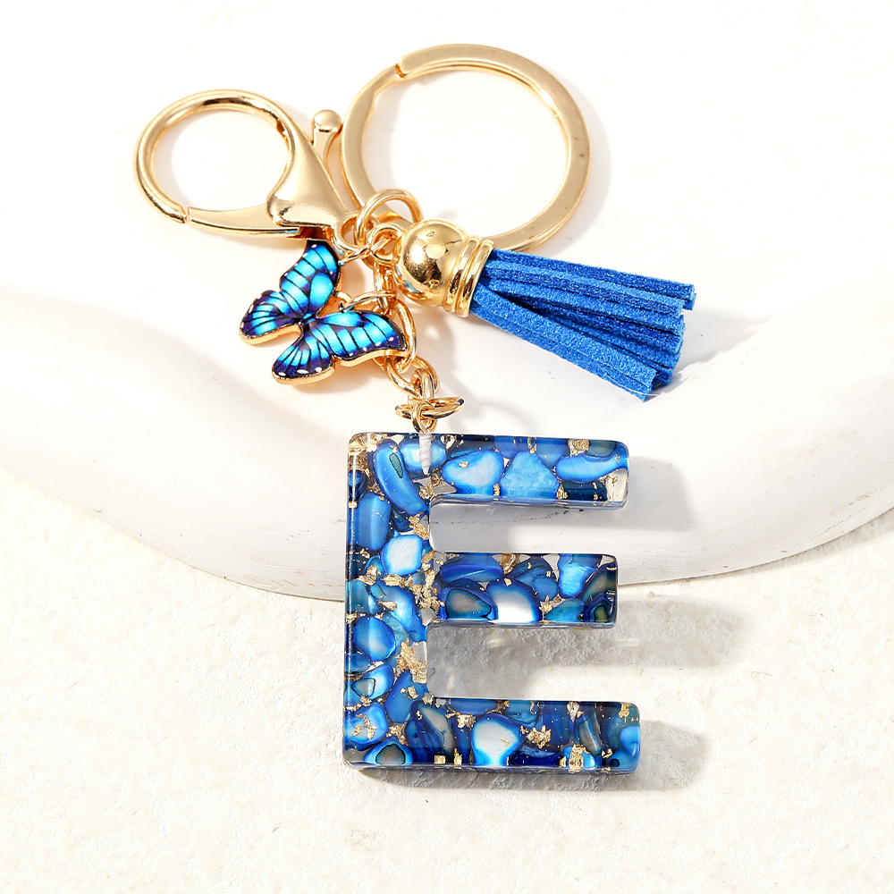 Nuevo transfronterizo mariposa 26 letras inglesas de cristal goteo llavero bolsos accesorios colgante de automóviles