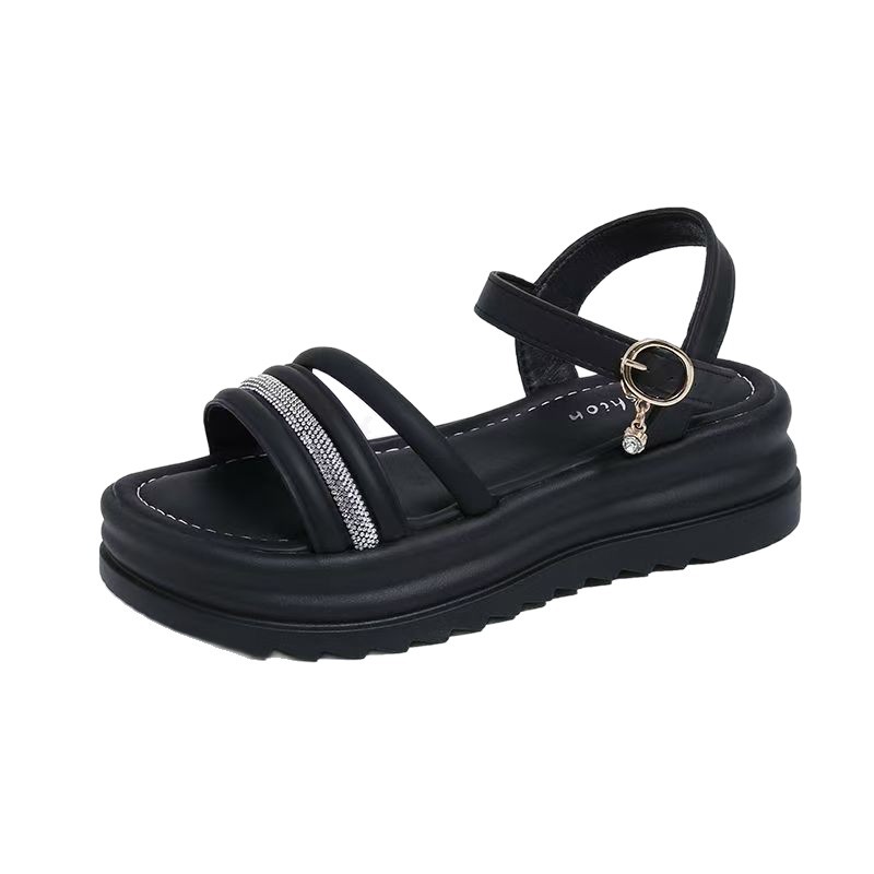 Sandalias de fondo plano para mujeres verano 2026 nuevo estilo de hadas estilo estilo de fondo grueso estilo versátil de diamante para usar zapatos romanos de playa