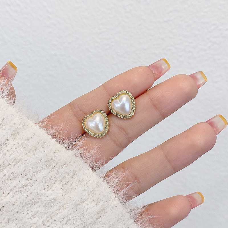 Pendientes de suministro empresarial de puestos de mercado nocturno pendientes al por mayor transfronterizos Pendientes de borla de temperamento de todo fósforo popular Pendientes coreanos