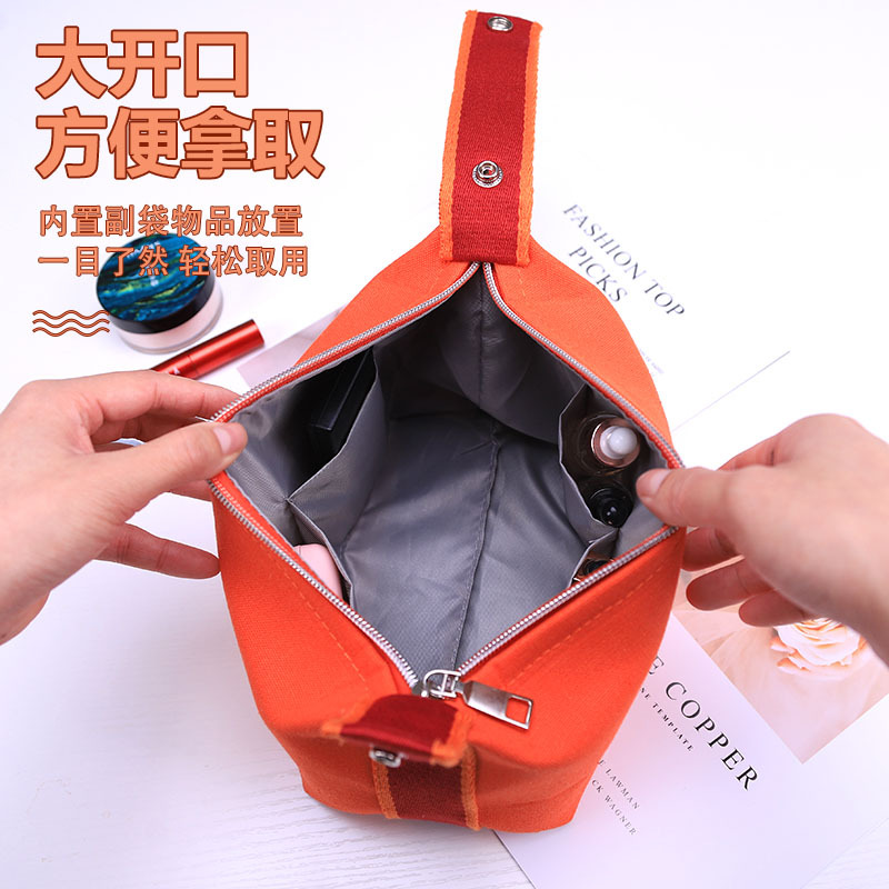 Bolsa de cosméticos de lona impermeable portátil de alta apariencia de gran capacidad de lavado bolsa de cosméticos de red roja portátil bolsa de almacenamiento de color sólido