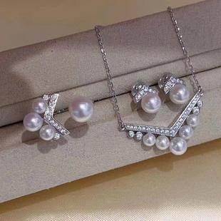 Classic V Design Gold injection freshwater pearl pendant ring earrings are round and basically flawless