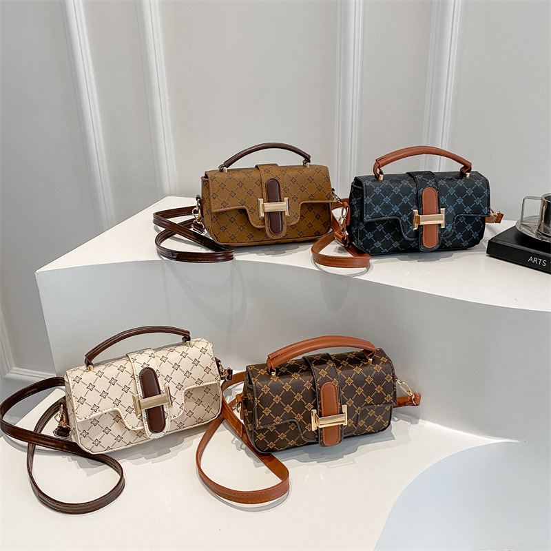 Bagos de color retro retro de estilo extranjero mujeres 2025 nuevo nicho diseño de empalme bolso pequeño bolso portátil de viaje