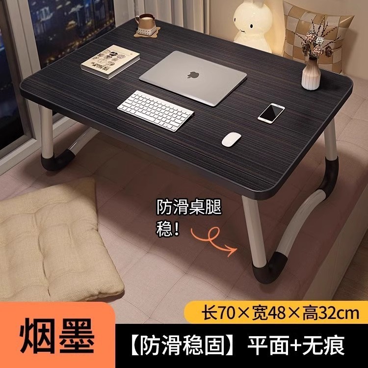 折り畳み可能なベッドの上の小さなテーブルは机のノートパソコンのテーブルを勉強します。|undefined
