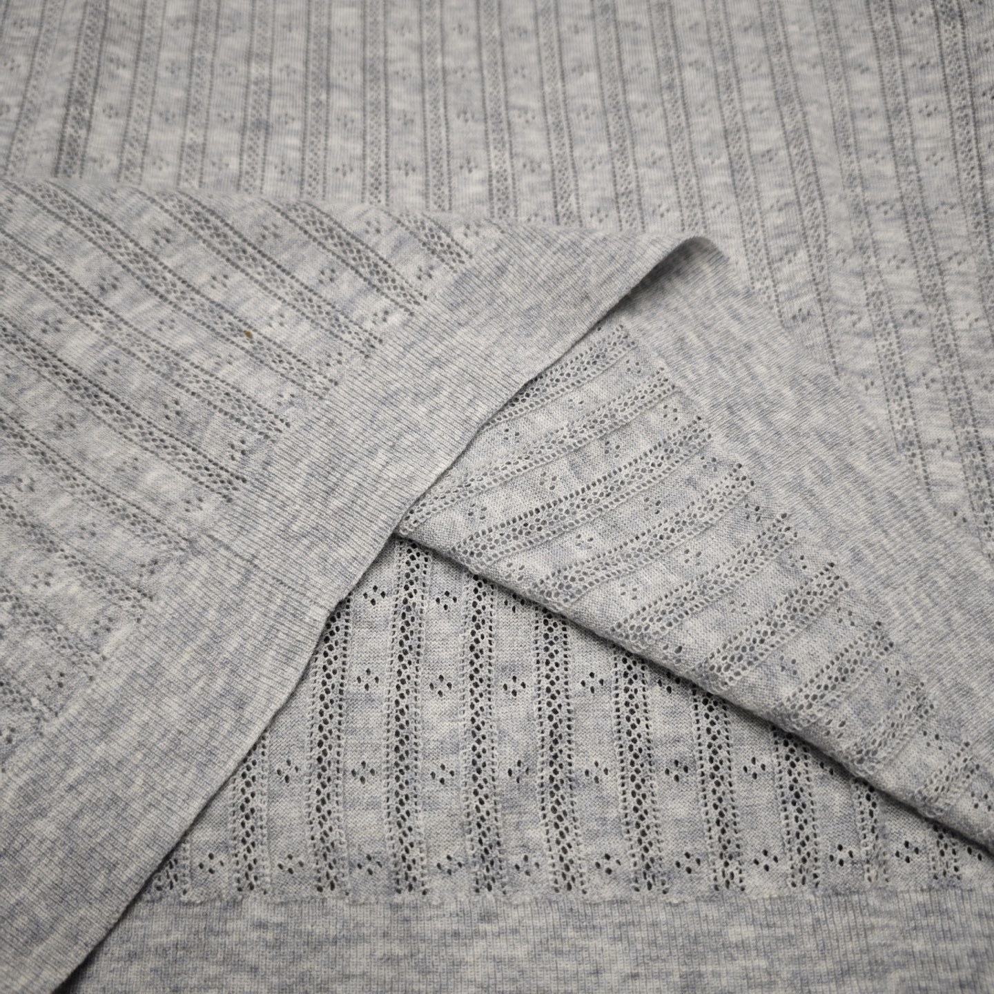 Summer knitted sweater with a round collar