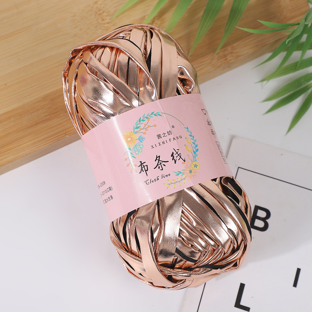 Línea textil Qian Zhi hilo de color mágico tejido a mano hilo de fantasía de color bricolaje en stock fábrica al por mayor