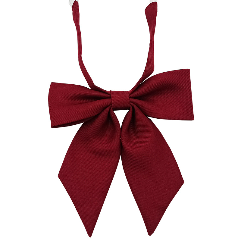 Spot al por mayor versión estrecha niña pequeña pajarita de raíz de plumas pajarita flor moda nuevo lazo color sólido jk pajarita satinado