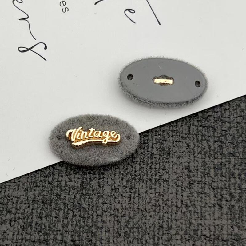 灰色系树脂组合纽扣标牌字母蝴蝶结小狗安心商标植绒针织衣标辅料|undefined