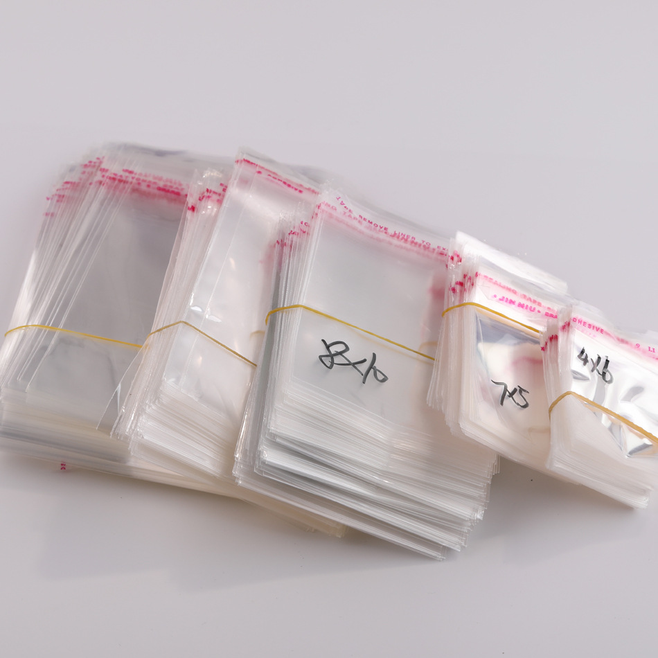 Accesorios de joyería de bricolaje bolsa de material bolsa opp bolsa de embalaje de plástico transparente bolsa de ropa bolsa autoadhesiva accesorios