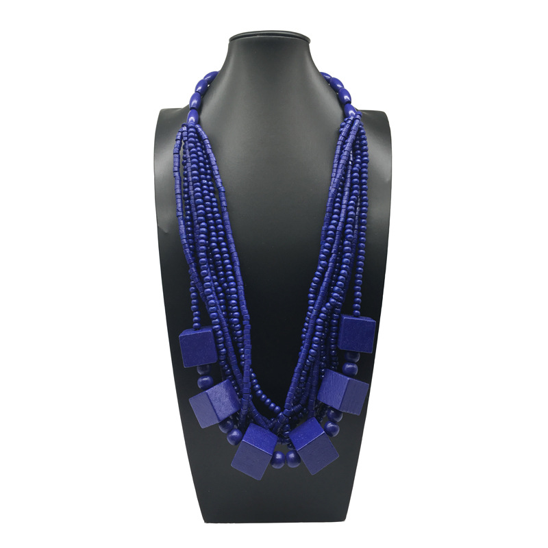 Collana lunga a strati con perle geometriche in legno donna_voghion.com