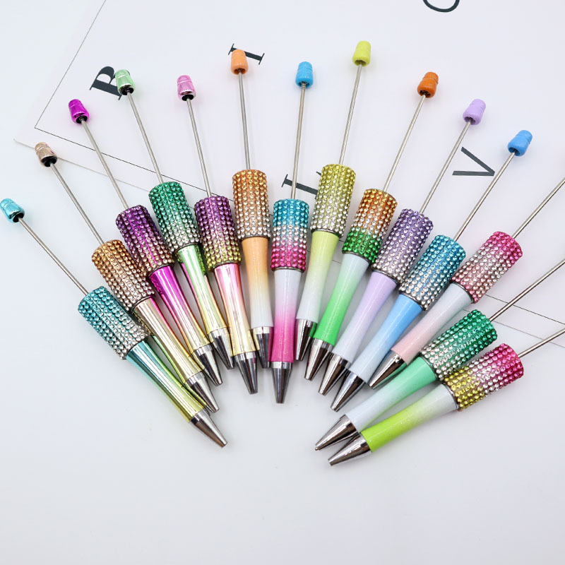 Bolígrafo giratorio de grano lindo de color degradado de tendencia de alto valor Bolígrafo de gomas galvanizado con cuentas de diamantes de bricolaje creativo