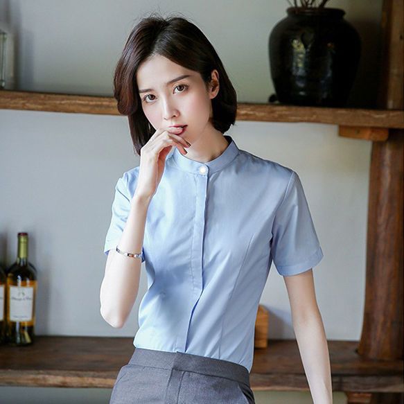 暗いボタンの立襟の韓国版の女性の職業のシャツのカジュアルな婦人服の上着の大きいサイズの長袖の防走光の白いシャツ
