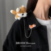 Yellow chain, brooch