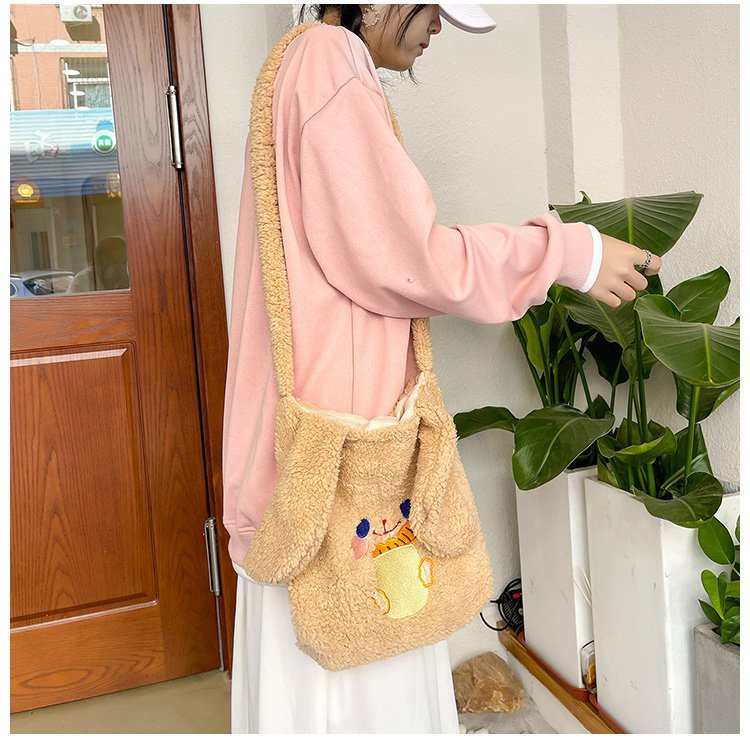 This autumn and winter hand-held bag with big ears, cute animal-embroidered fur, and a simple lambskin large-capacity student backpack undefined