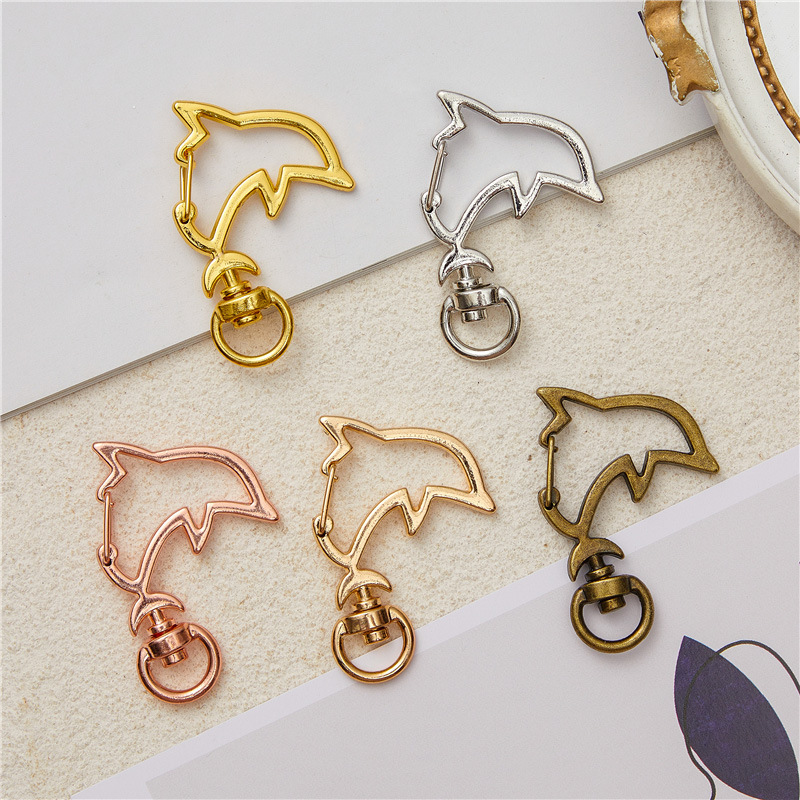 Spot direct zinc alloy keychain accessories pendant male and female DIY cartoon dolphin cherry blossom keychain material