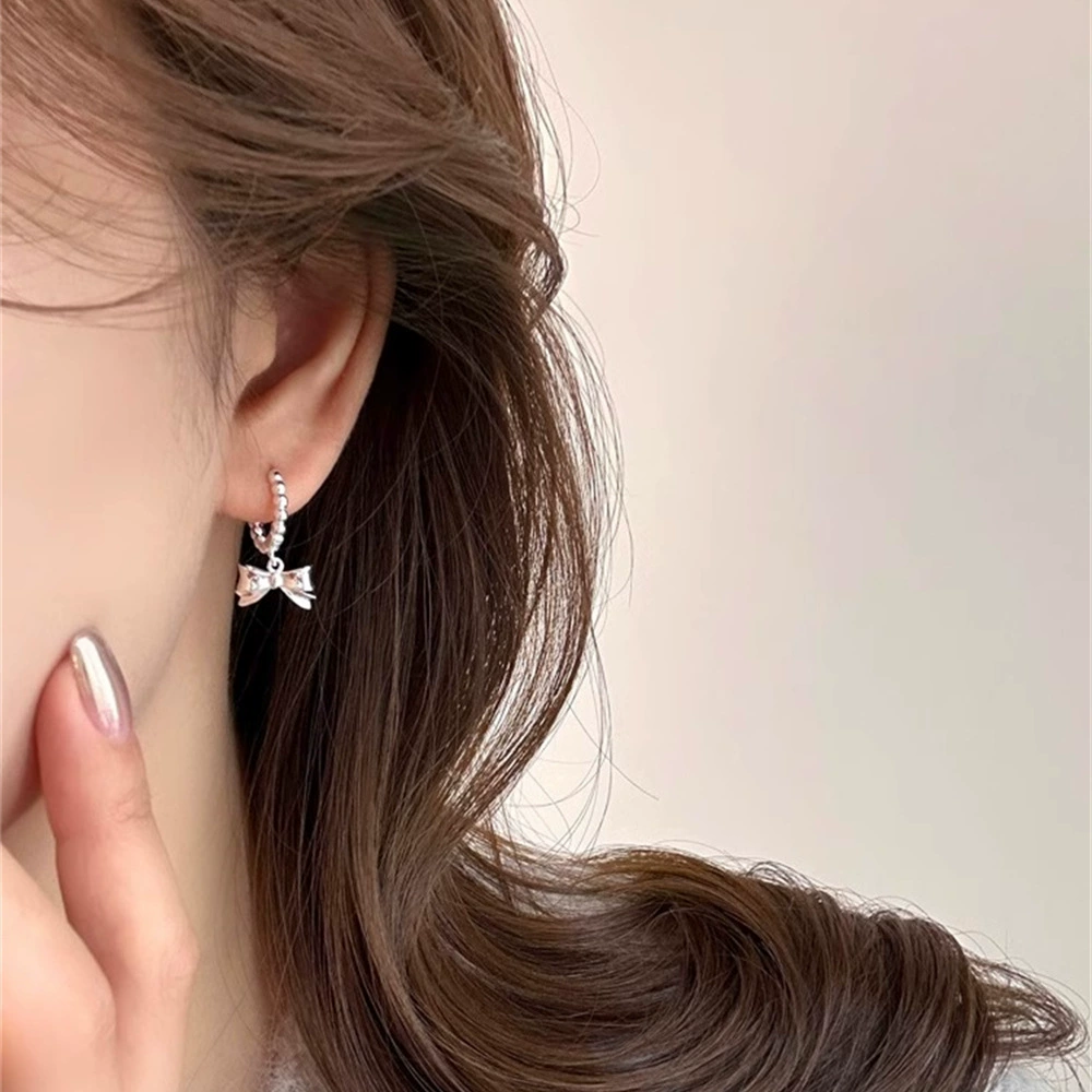 Three dimensional small design earrings with bow, 925 sample silver, light luxury style, high-quality style