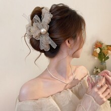 大号蝴蝶结珍珠头发抓夹女高级感2026新发量大后脑勺盘发夹鲨鱼夹