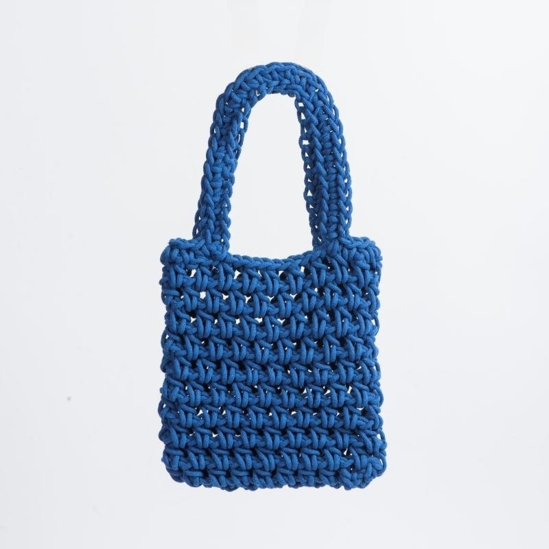 Redes de pesca perforadas tejidas a mano bolsos de teléfono móvil bolsos de moda casuales bolsos de playa de vacaciones de verano de punto