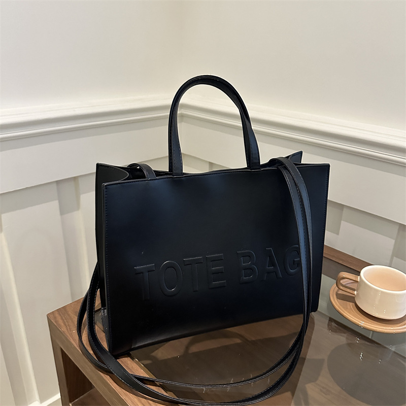 2024 nueva gran capacidad simple mochila de hombro texturizada bolso de mano letras de impresión clase viaje bolsa de mano