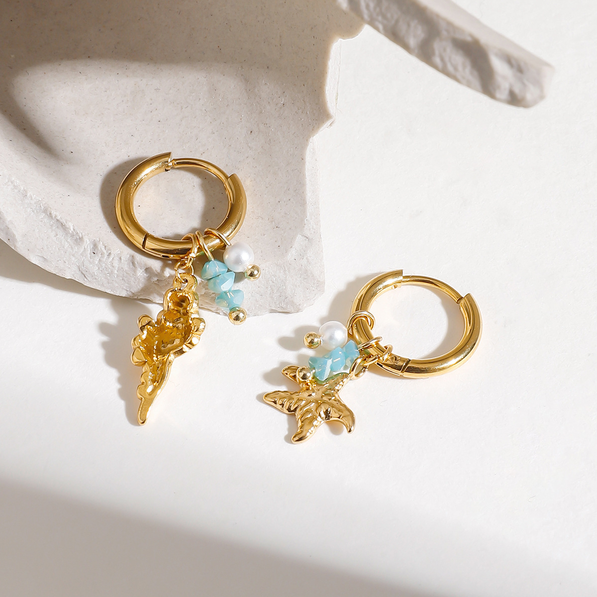 Wanxing Europa y los Estados Unidos de perlas de piedra triturada estrella de mar colgante de rosca de aretes de estilo marino estilo universal aretes de acero inoxidable transfronterizos