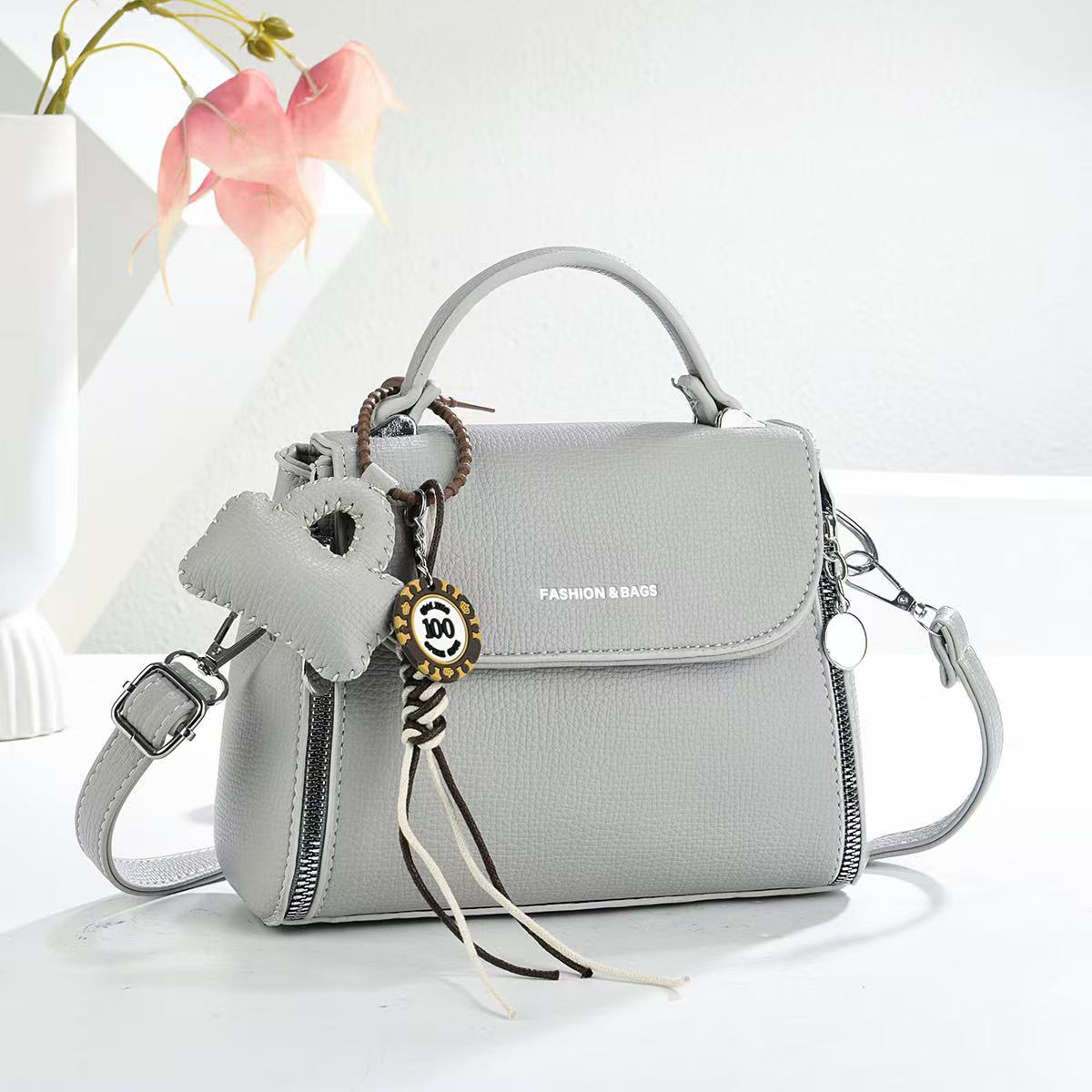 Bolsas de textura universal bolsas de mano colgantes bolsas de mano de transporte diario bolsas de hombro de moda casuales bolsas transfronterizas
