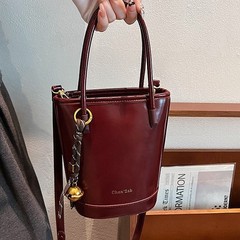 クロスボーダーのシンプルなレトロなハンドバッグの女性2025年と秋の新しい韓国版バケツバッグ
