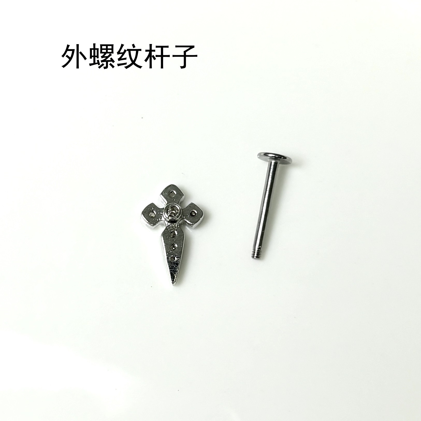 Silver pointed spike labret stud material detail